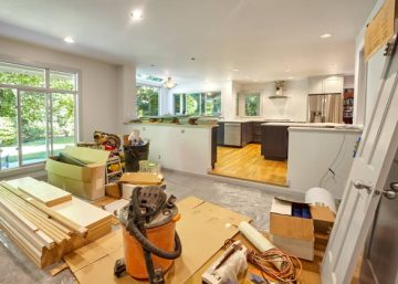 istockphoto-1477568555-612×612 Shelves, circular saw, doors and other remodeling tools and supplies fill the family room as the kitchen is worked on